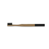 bamboo toothbrush with charcoal infused bristles . compostable. sustainable.