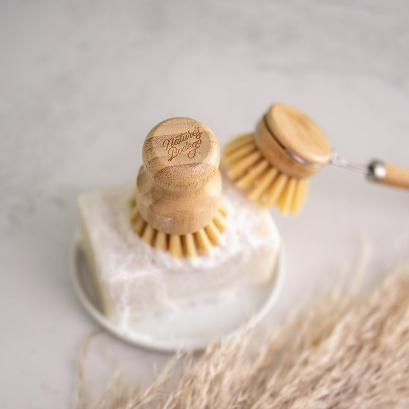 bamboo scrubber brush and bamboo dish brush on a solid dish soap. compostable. plastic free. zero waste. eco friendly