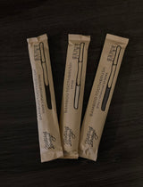 bamboo toothbrushes in paper compostable packaging